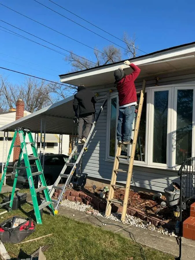 Restoration crew performing exterior repair in Ledyard